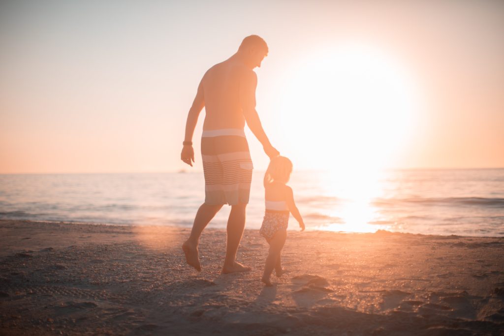 Father with child at the beach 