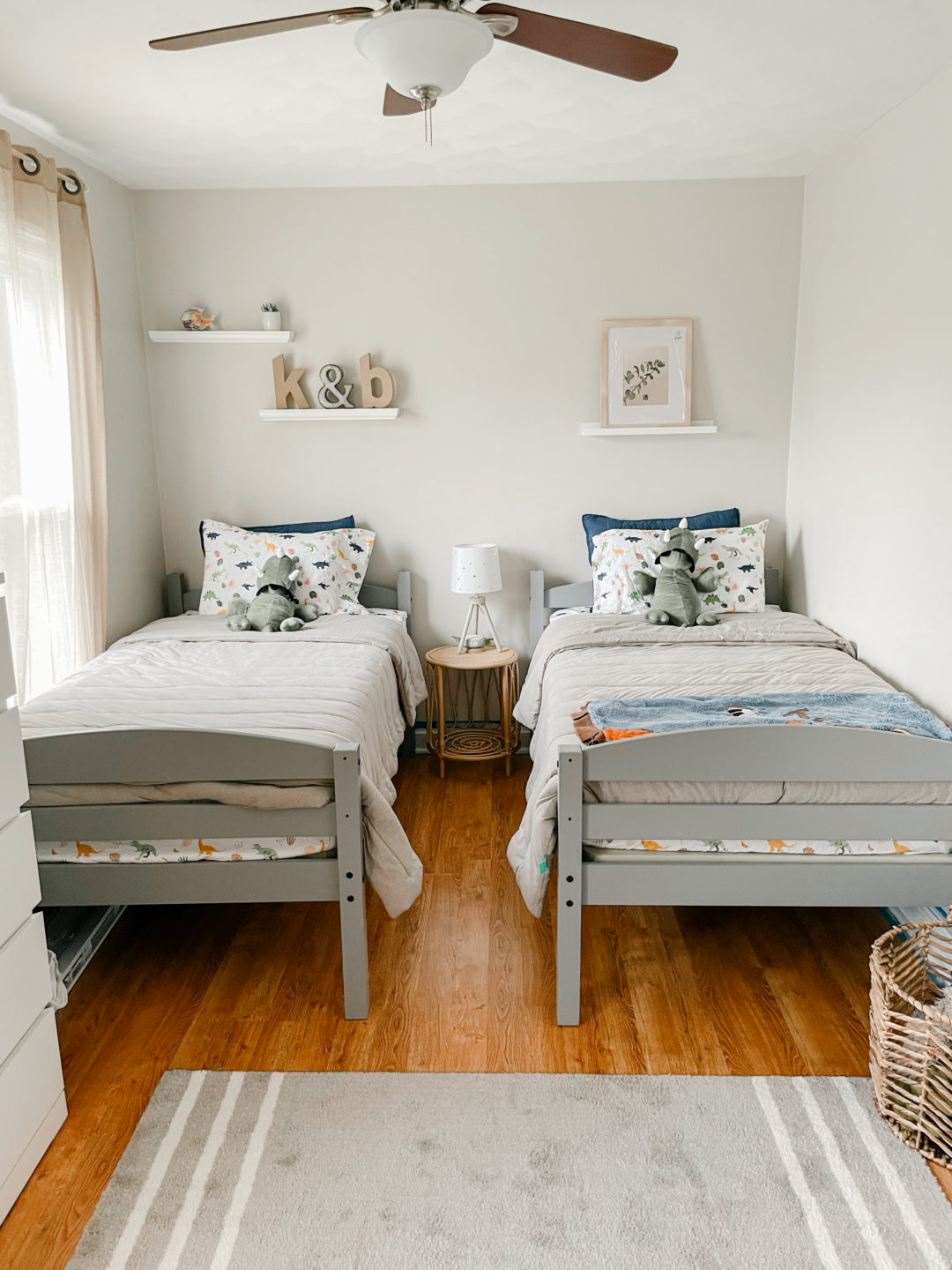 side by side twin beds in a small room,