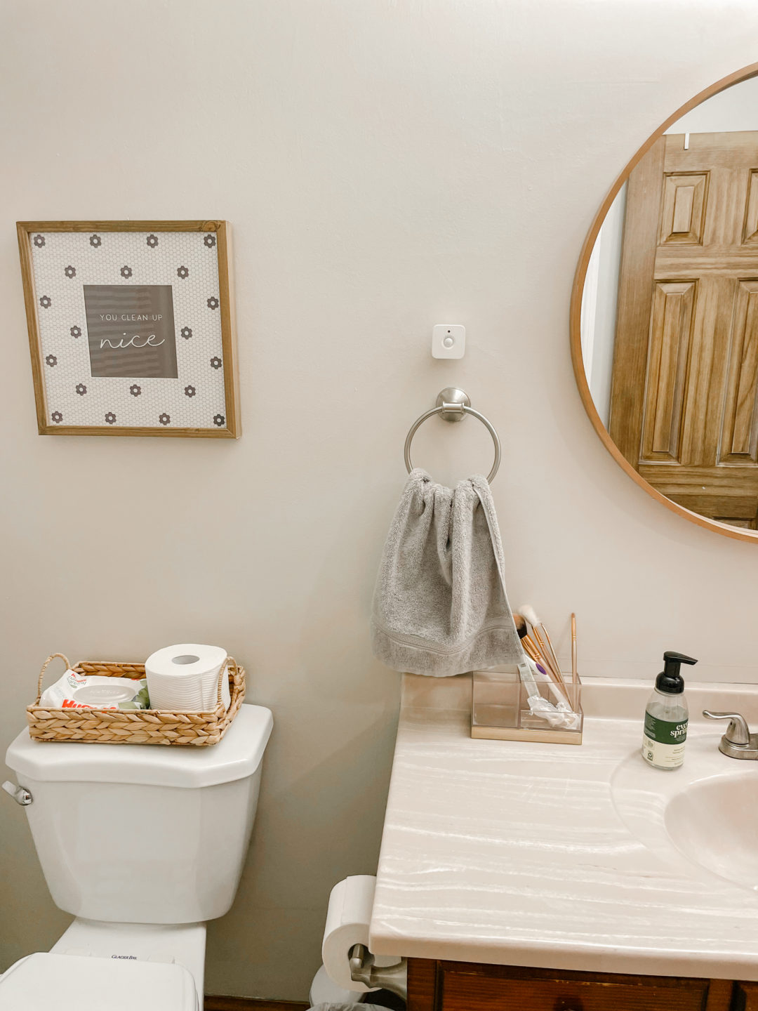 you clean up nice bathroom art with round mirror from hearth and home